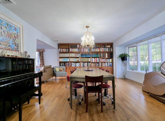 237 Berry Hill Rd, Syosset, NY 11791 - dining area with a chandelier and light wood finished floors