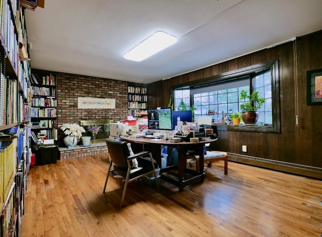 237 Berry Hill Rd, Syosset, NY 11791 - office space featuring wood-type flooring, a fireplace, wood walls, and a baseboard heating unit