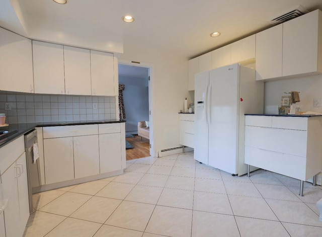 237 Berry Hill Rd, Syosset, NY 11791 - kitchen with tasteful backsplash, stainless steel dishwasher, white cabinets, white fridge with ice dispenser, and baseboard heating