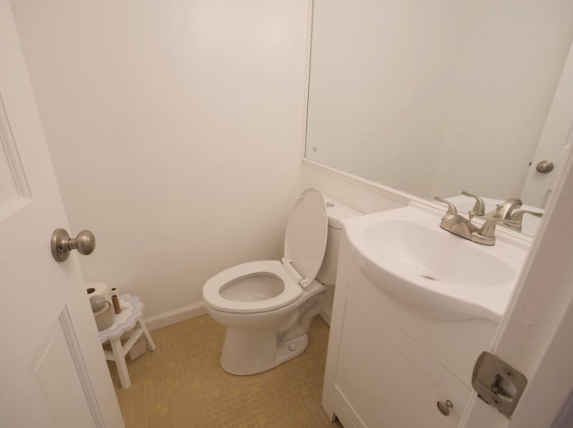 237 Berry Hill Rd, Syosset, NY 11791 - half bath with tile patterned floors, toilet, baseboards, and vanity