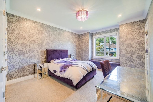 bedroom with carpet floors, wallpapered walls, baseboards, and ornamental molding