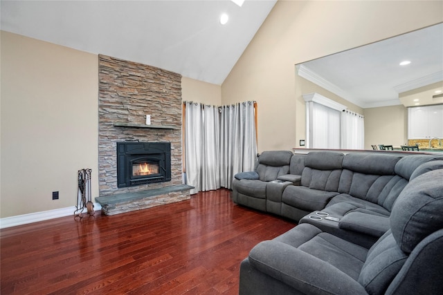 living area featuring high vaulted ceiling, a fireplace, wood finished floors, baseboards, and crown molding