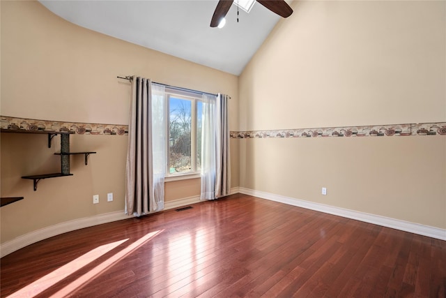 unfurnished room with high vaulted ceiling, a ceiling fan, visible vents, baseboards, and dark wood finished floors