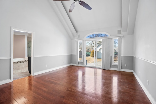 unfurnished living room with a ceiling fan, wood-type flooring, high vaulted ceiling, and baseboards