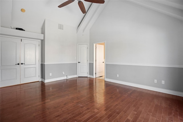 unfurnished bedroom with high vaulted ceiling, baseboards, visible vents, and wood finished floors