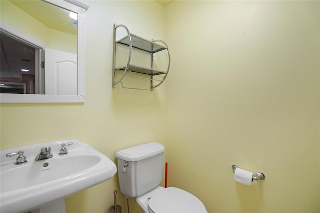 bathroom with a sink and toilet