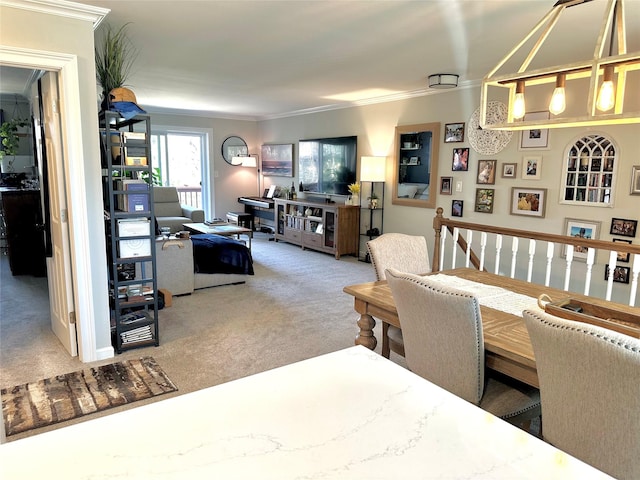 carpeted dining space featuring crown molding