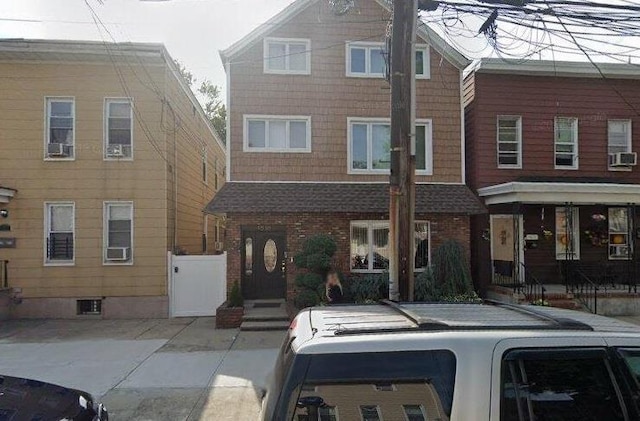 view of front of home featuring brick siding