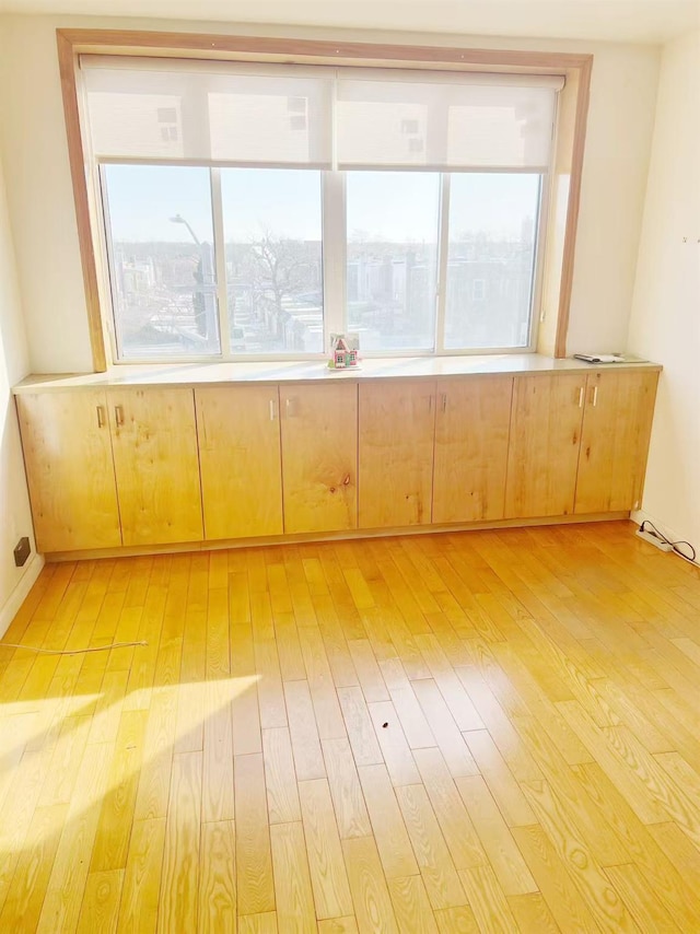 spare room featuring light wood-style floors