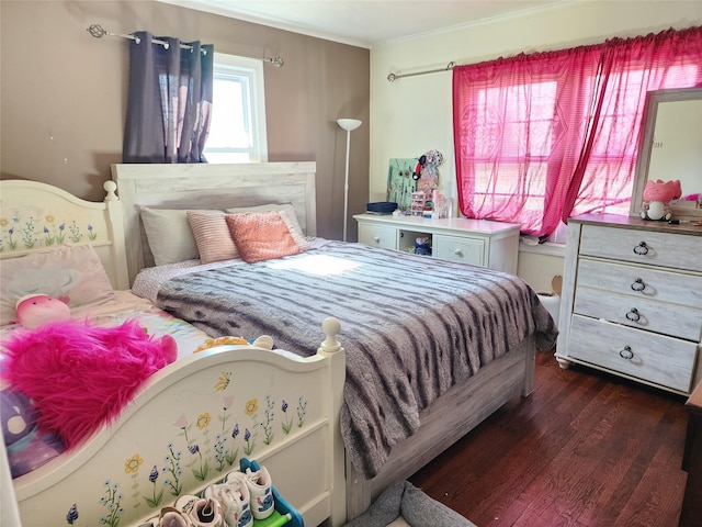 bedroom with dark wood-type flooring and ornamental molding