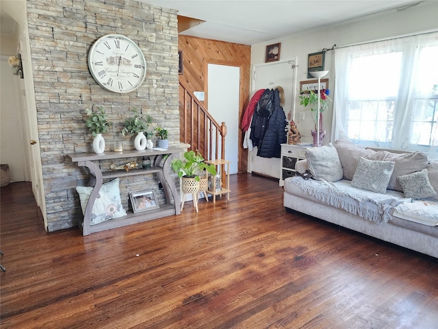 living room featuring stairway, a fireplace, and wood finished floors