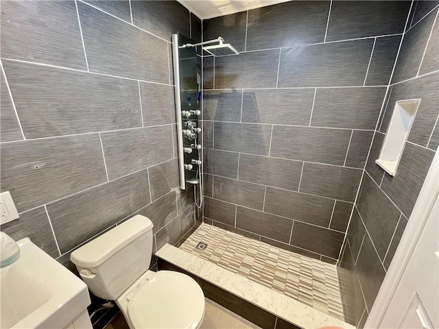 full bathroom with toilet and a tile shower