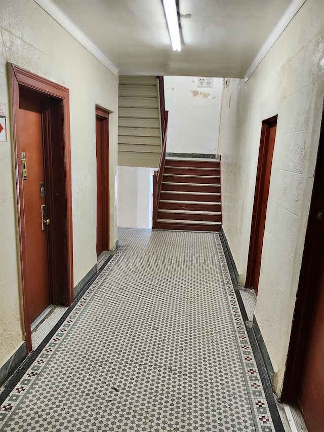 hall with stairway and ornamental molding