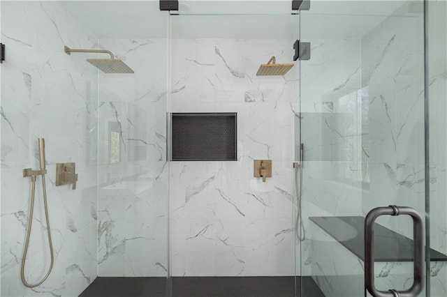 full bath with a marble finish shower