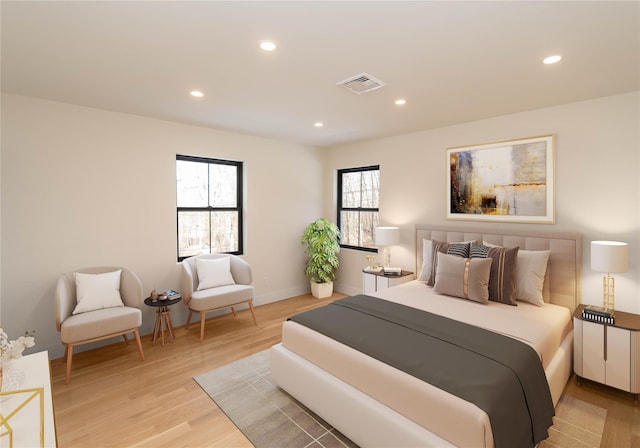 bedroom featuring multiple windows, recessed lighting, visible vents, and light wood-style floors