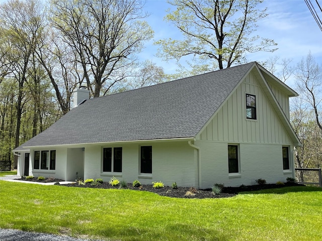 16 Shunpike, Clinton Corners, NY 12514 - view of front facade with board and batten siding, a chimney, a shingled roof, a front yard, and brick siding