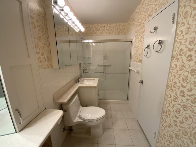 full bath featuring toilet, a shower stall, vanity, tile patterned flooring, and wallpapered walls