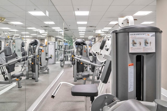 workout area with a paneled ceiling