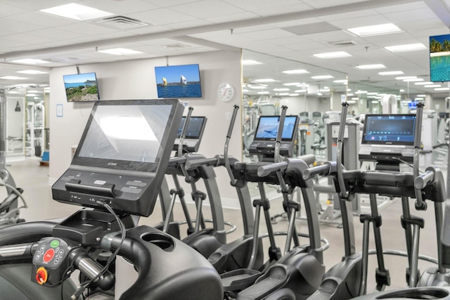 gym with a drop ceiling and visible vents