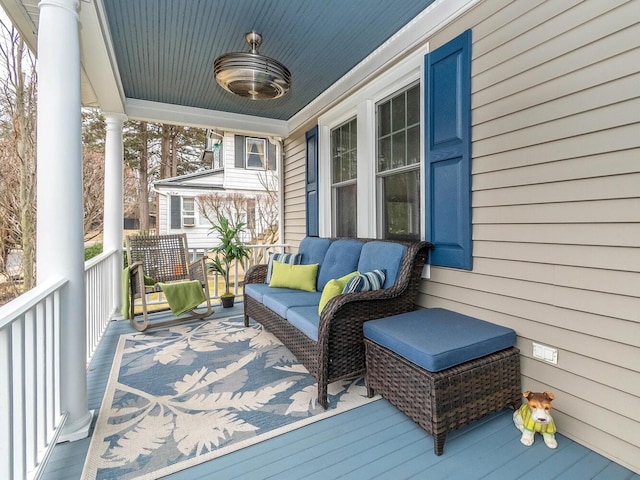 deck featuring outdoor lounge area and a porch