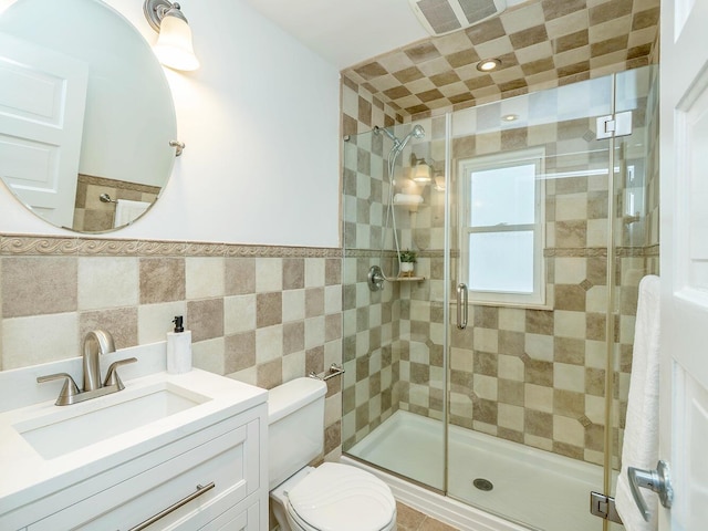 full bath with toilet, a shower stall, and visible vents