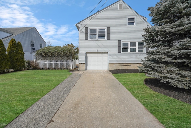 view of front of home featuring an attached garage, concrete driveway, a front yard, and fence