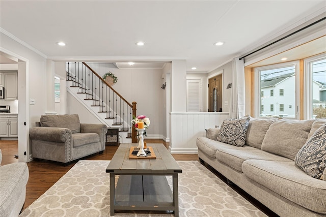 living area with recessed lighting, ornamental molding, stairs, and wood finished floors