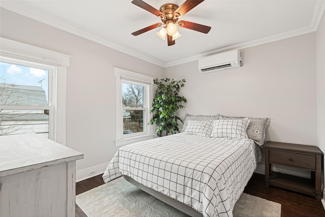 bedroom featuring a ceiling fan, dark wood finished floors, a wall unit AC, crown molding, and baseboards