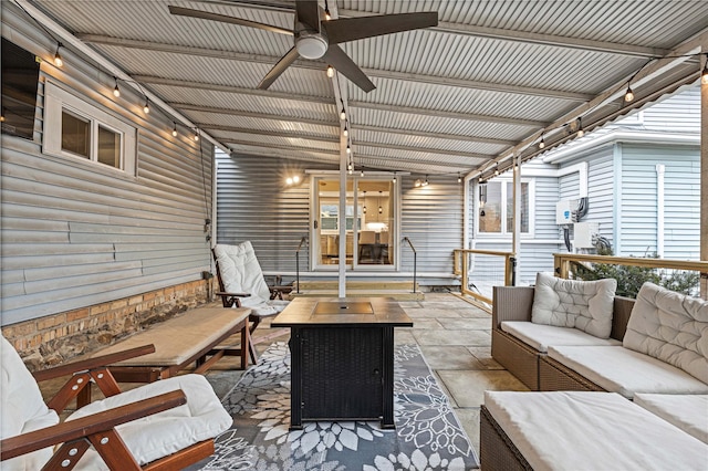 exterior space featuring an outdoor living space and a ceiling fan