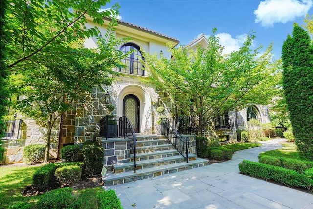 86 Gaylord Dr S, Brooklyn, NY 11234 - doorway to property with a tiled roof and stucco siding