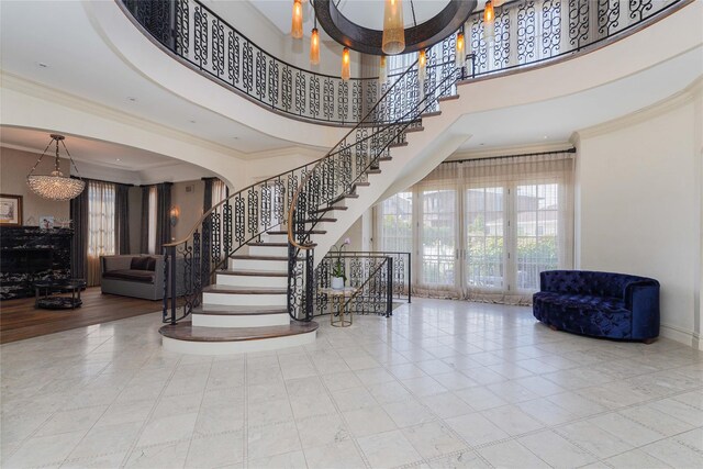 86 Gaylord Dr S, Brooklyn, NY 11234 - entryway with ornamental molding, arched walkways, a high ceiling, and stairs