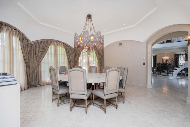 86 Gaylord Dr S, Brooklyn, NY 11234 - dining space with visible vents, arched walkways, a towering ceiling, stairs, and a chandelier