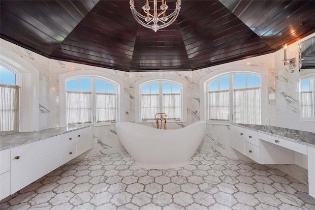 86 Gaylord Dr S, Brooklyn, NY 11234 - bathroom with a notable chandelier, crown molding, a freestanding bath, and vanity