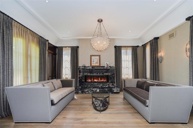 86 Gaylord Dr S, Brooklyn, NY 11234 - living area featuring visible vents, a fireplace, and light wood finished floors