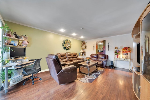 living room featuring crown molding, baseboards, and hardwood / wood-style floors