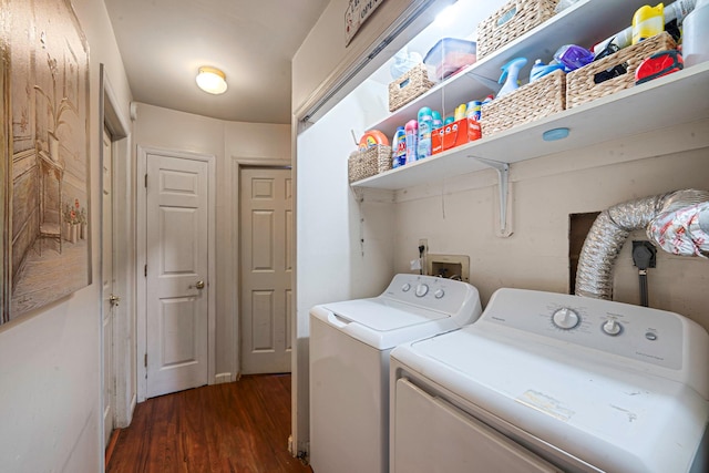 laundry room featuring dark wood-style floors, laundry area, and washer and clothes dryer