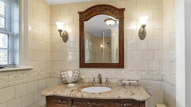 bathroom featuring tile walls and vanity