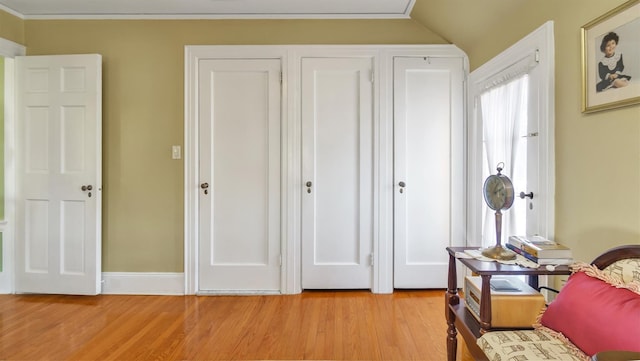 bedroom featuring light wood-type flooring and baseboards