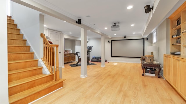 interior space featuring ornamental molding and light wood finished floors