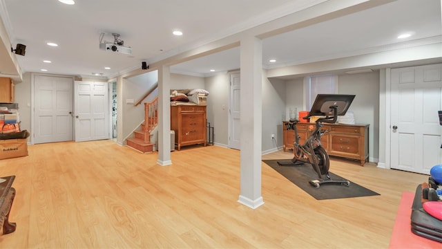 workout area featuring crown molding, recessed lighting, baseboards, and light wood-style floors