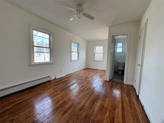 empty room with dark wood-style floors, a baseboard radiator, a ceiling fan, and baseboards