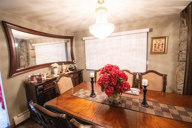 dining area with baseboard heating and an inviting chandelier