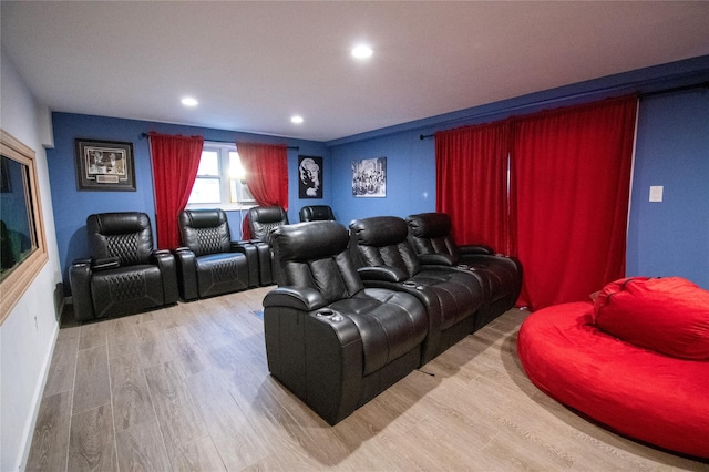 cinema room with baseboards, wood finished floors, and recessed lighting