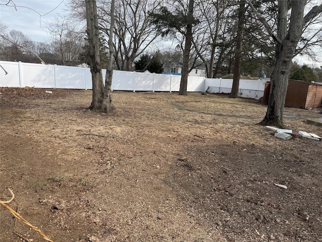 view of yard with a fenced backyard