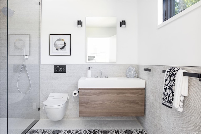 bathroom featuring toilet, walk in shower, vanity, and tile walls