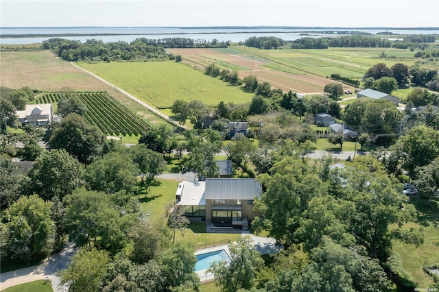 birds eye view of property with a water view and a rural view