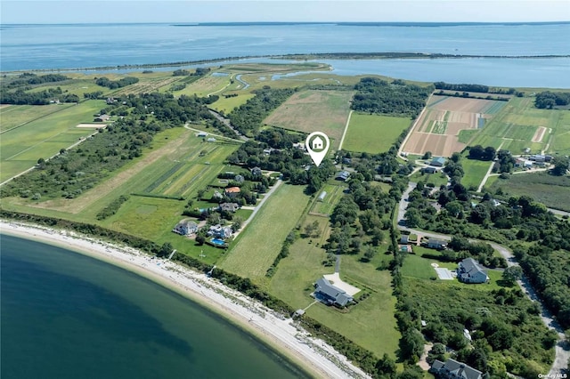 birds eye view of property with a water view and a rural view