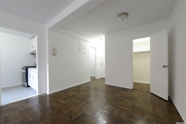 empty room featuring baseboards