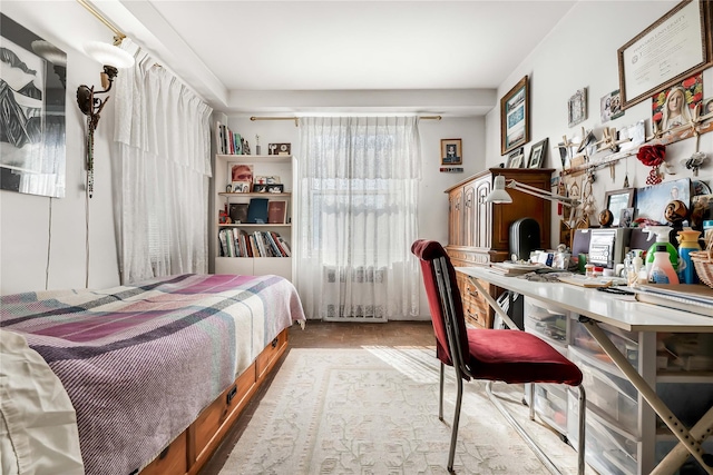 bedroom featuring radiator