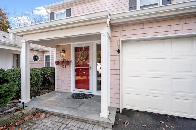 doorway to property featuring a garage